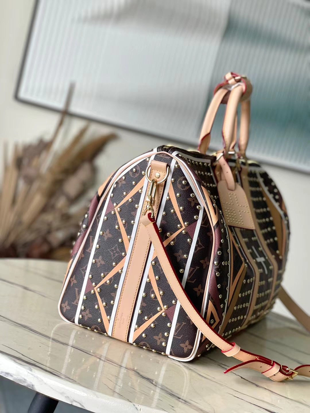LOUIS VUITTON KEEPALL BANDOULIÈRE 50 IN PARFLECHE PATTERN MONOGRAM CANVAS