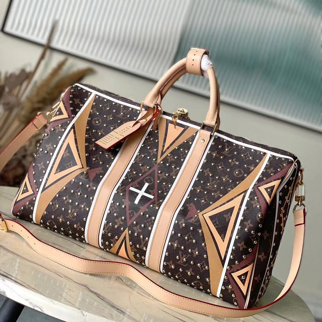 LOUIS VUITTON KEEPALL BANDOULIÈRE 50 IN PARFLECHE PATTERN MONOGRAM CANVAS