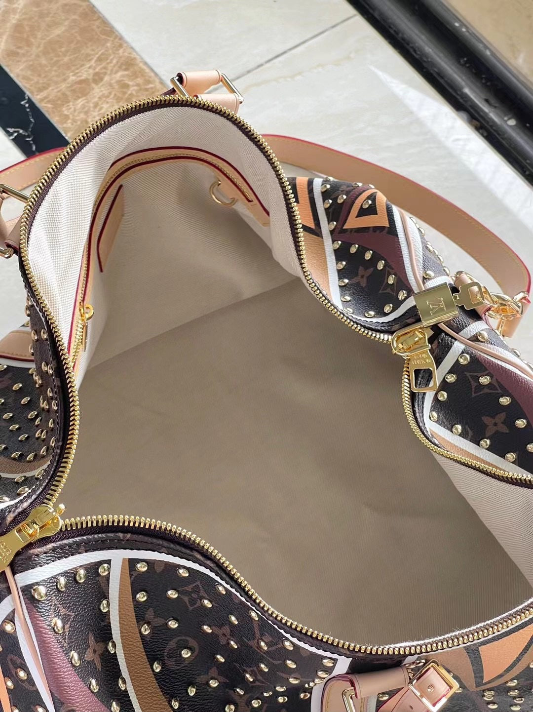 LOUIS VUITTON KEEPALL BANDOULIÈRE 50 IN PARFLECHE PATTERN MONOGRAM CANVAS