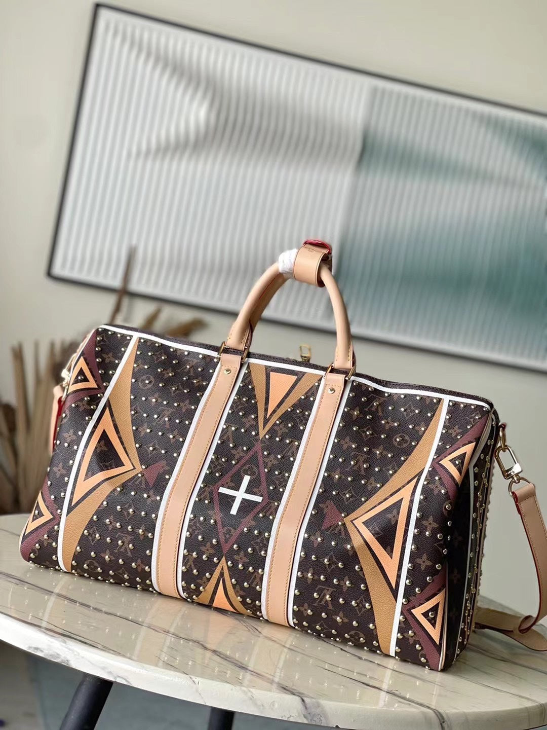 LOUIS VUITTON KEEPALL BANDOULIÈRE 50 IN PARFLECHE PATTERN MONOGRAM CANVAS