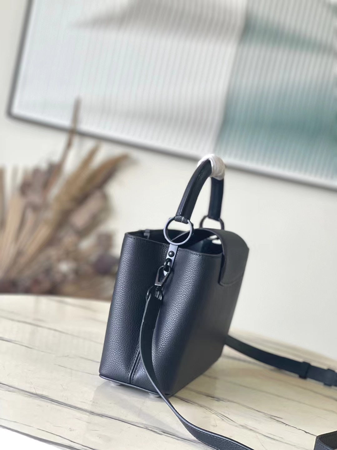 LOUIS VUITTON CAPUCINES EAST-WEST 27 IN BLACK TAURILLON