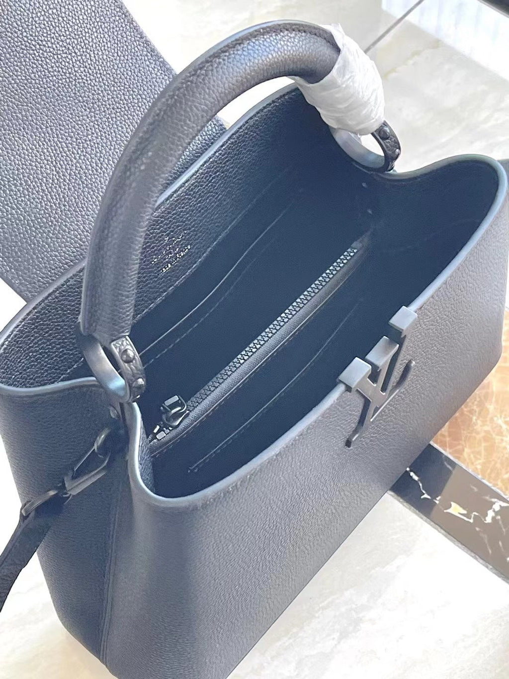 LOUIS VUITTON CAPUCINES EAST-WEST 27 IN BLACK TAURILLON