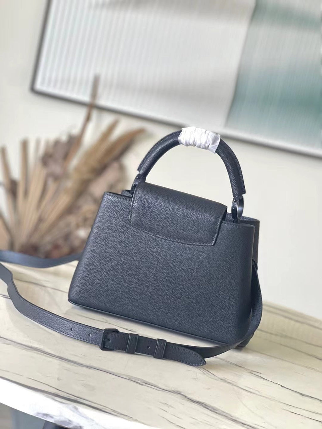 LOUIS VUITTON CAPUCINES EAST-WEST 27 IN BLACK TAURILLON