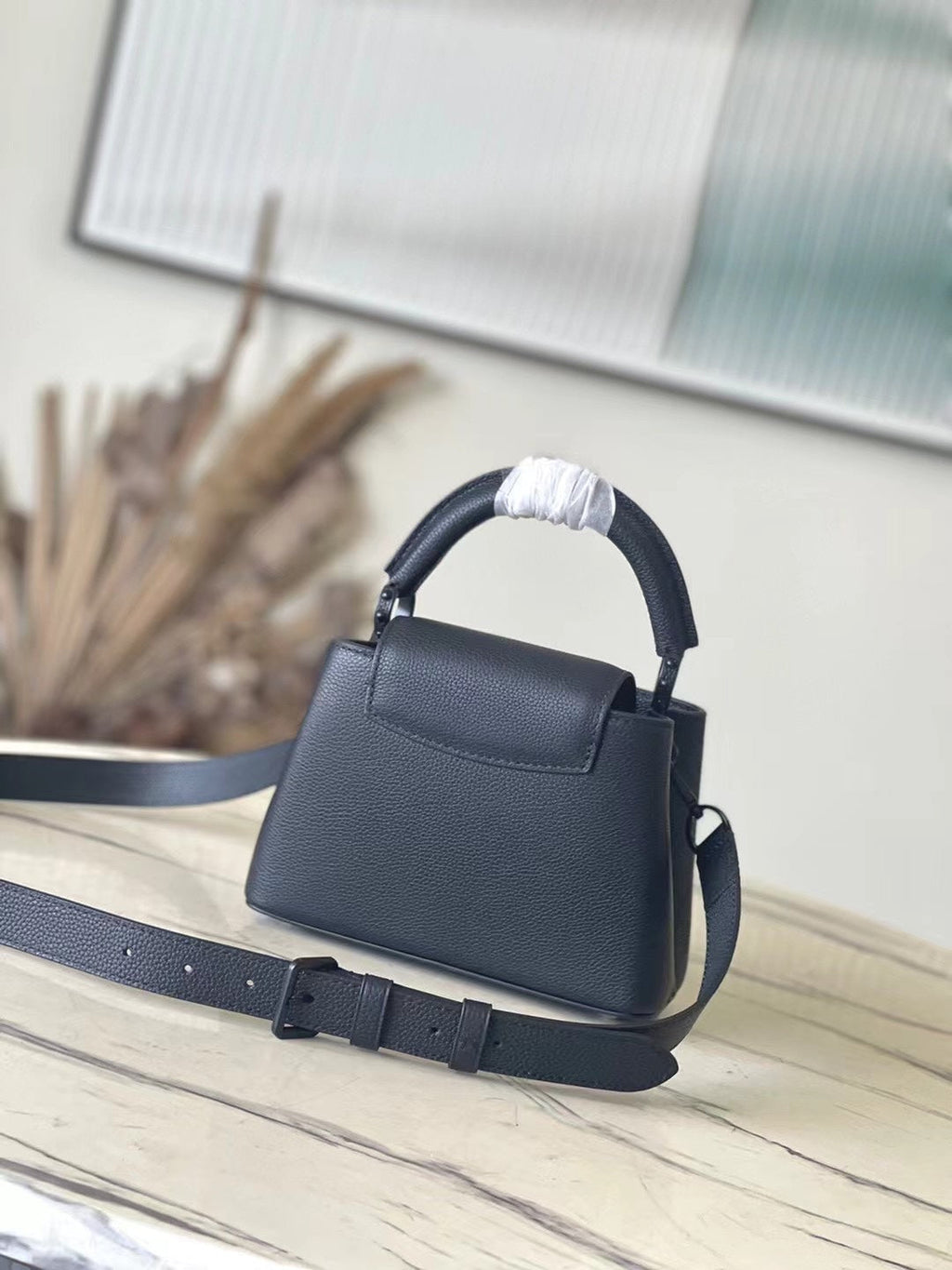 LOUIS VUITTON CAPUCINES EAST-WEST MINI 21 IN BLACK TAURILLON