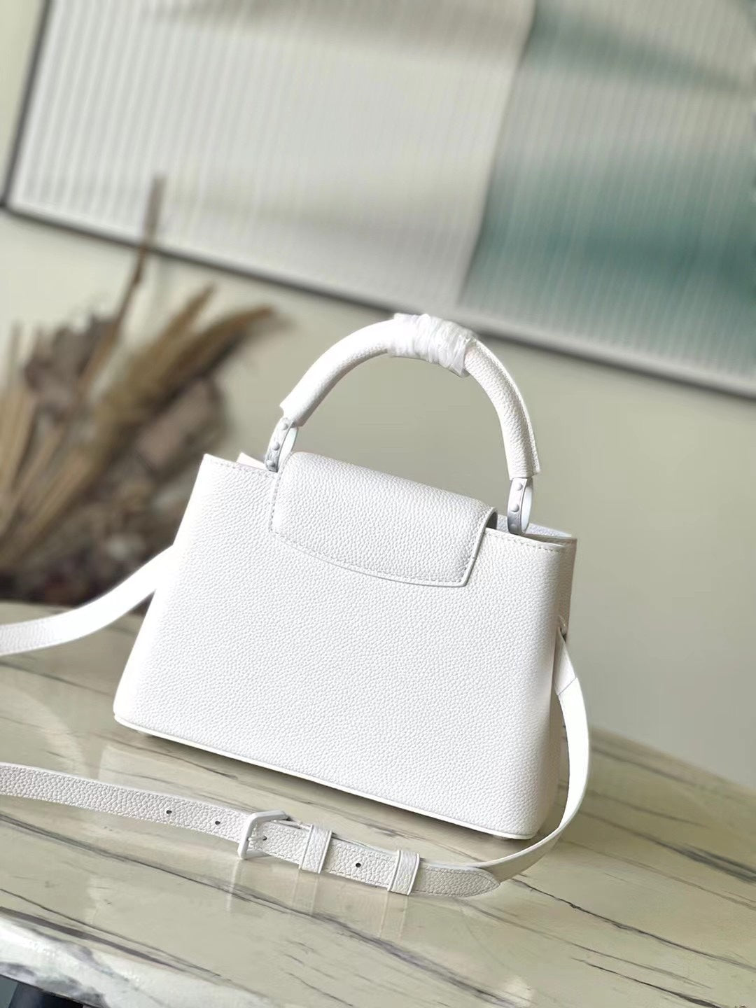 LOUIS VUITTON CAPUCINES EAST-WEST BB 27 IN WHITE TAURILLON