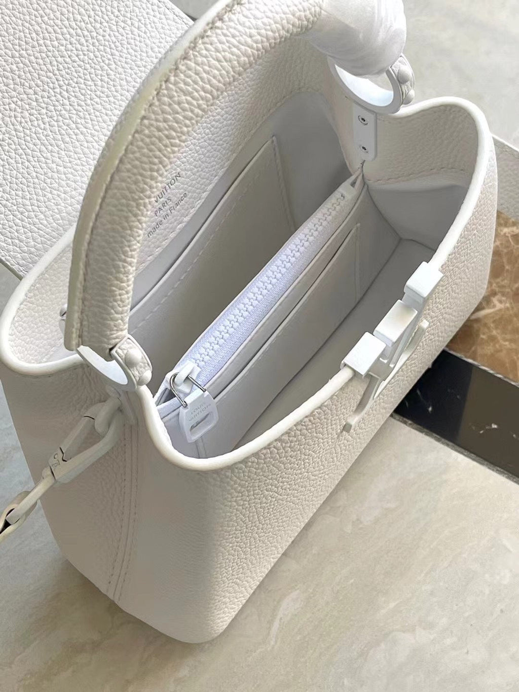 LOUIS VUITTON CAPUCINES EAST-WEST MINI 21 IN WHITE TAURILLON