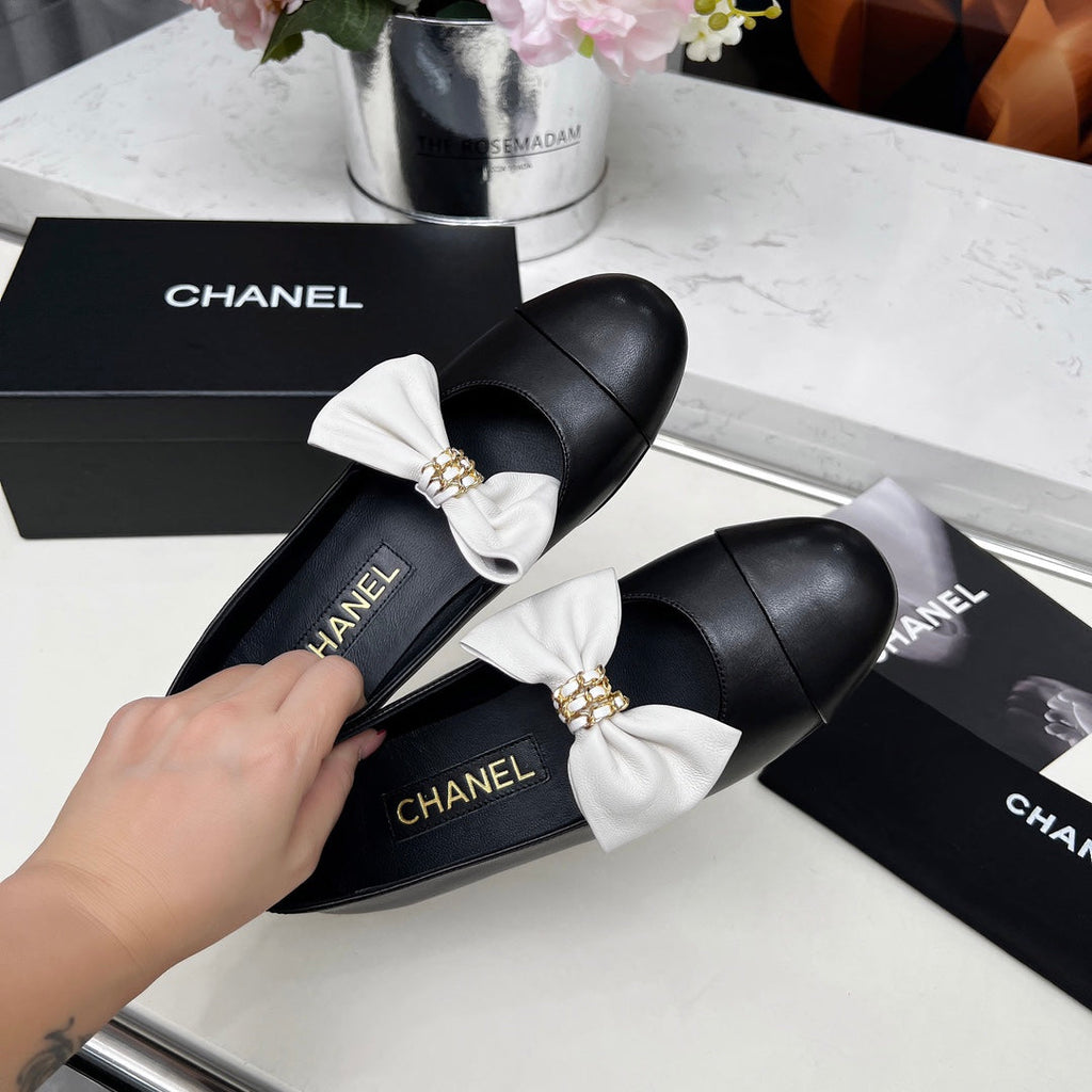 CHANEL 25S MARY JANES IN BLACK CALFSKIN WITH WHITE BOW GOLD HARDWARE