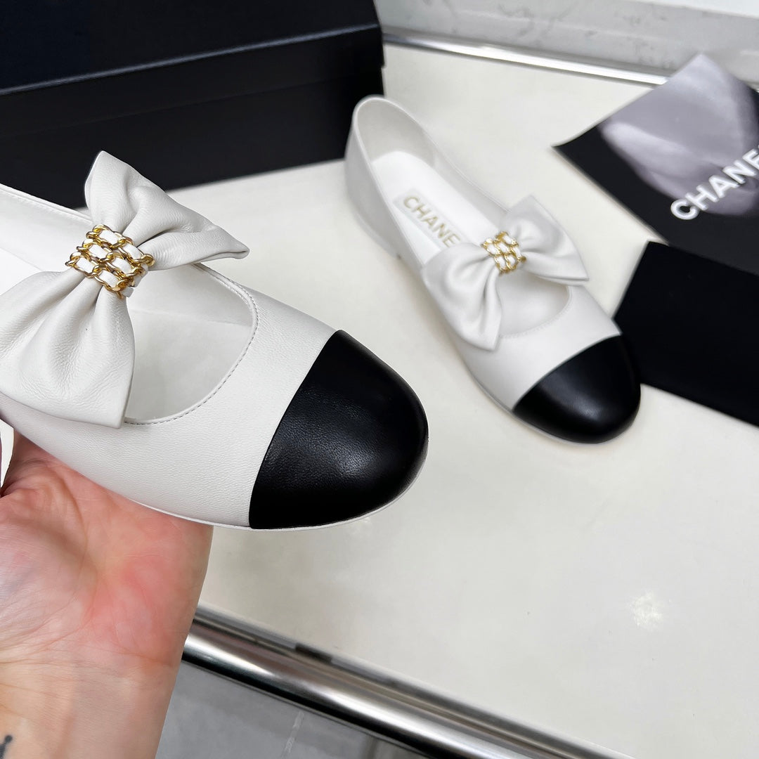 CHANEL 25S MARY JANES IN WHITE MIX BLACK CALFSKIN WITH BOW GOLD HARDWARE