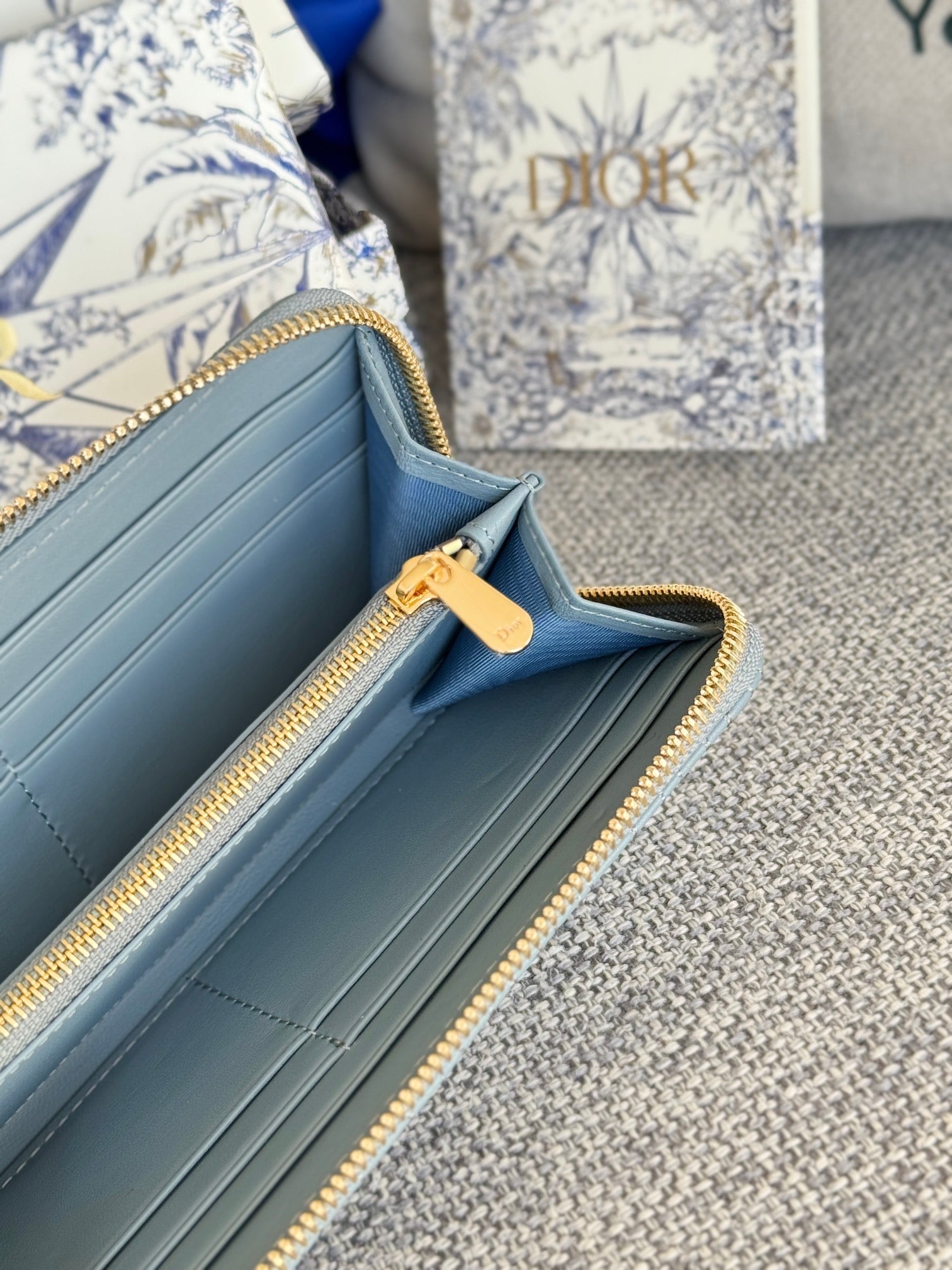 DIOR VERTICAL LONG ZIP WALLET 20 IN BABY BLUE QUILTED ALLOVER CALFSKIN