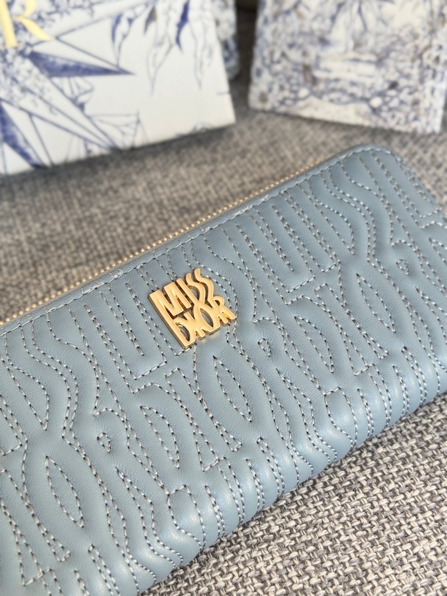 DIOR VERTICAL LONG ZIP WALLET 20 IN BABY BLUE QUILTED ALLOVER CALFSKIN