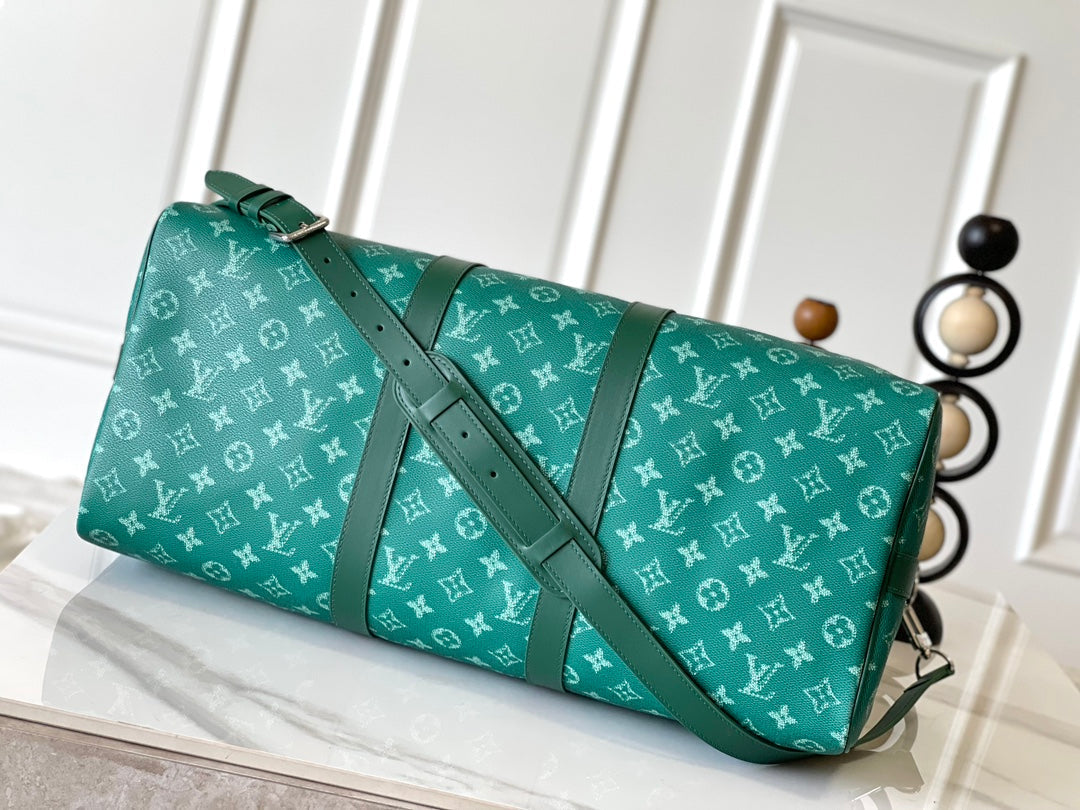LOUIS VUITTON KEEPALL BANDOULIÈRE 50 IN GREEN MONOGRAM HERITAGE CANVAS