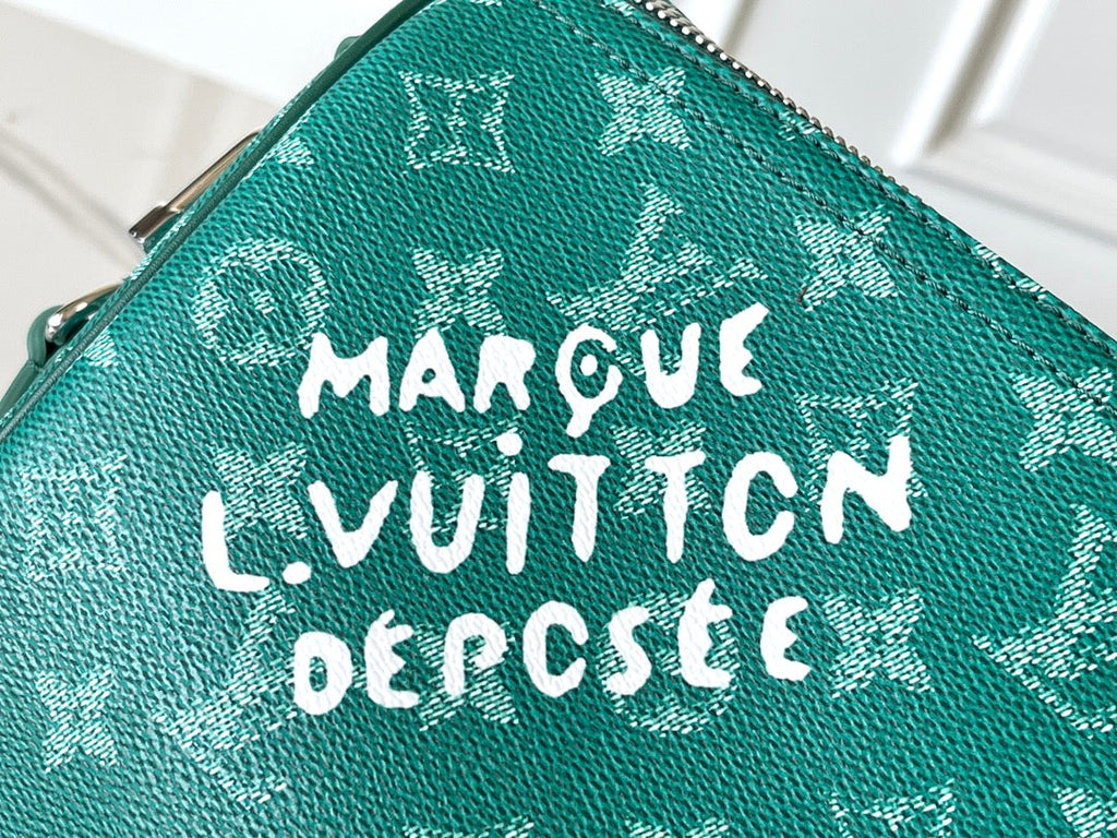 LOUIS VUITTON KEEPALL BANDOULIÈRE 50 IN GREEN MONOGRAM HERITAGE CANVAS