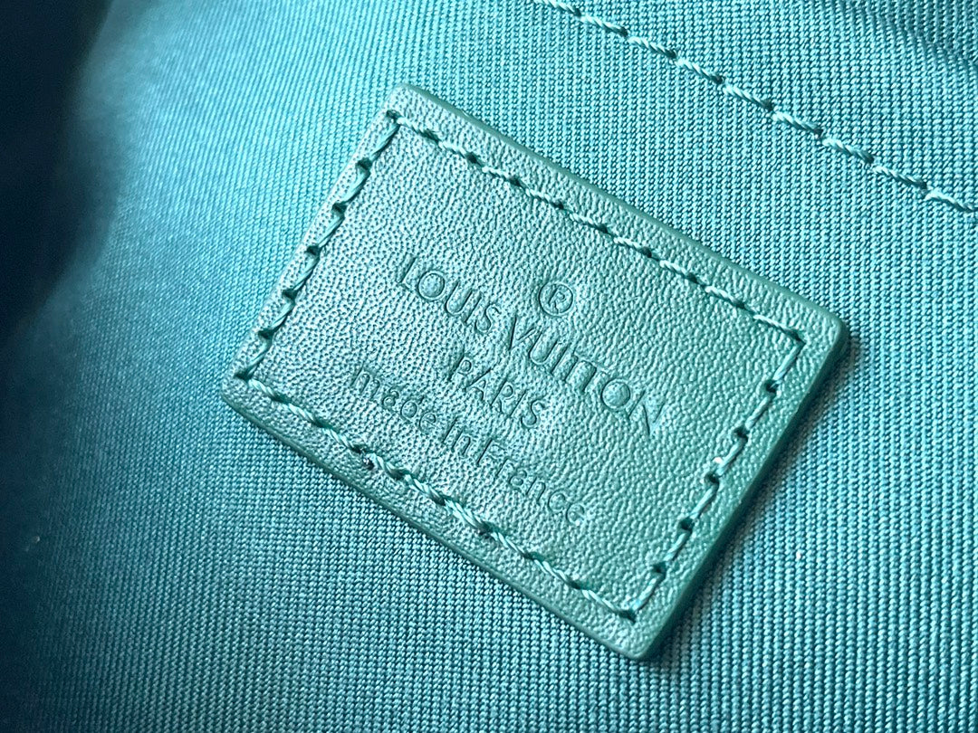 LOUIS VUITTON KEEPALL BANDOULIÈRE 25 IN GREEN MONOGRAM HERITAGE CANVAS