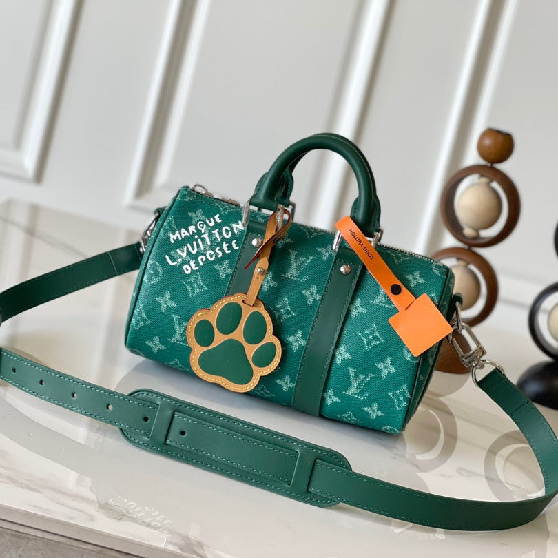 LOUIS VUITTON KEEPALL BANDOULIÈRE 25 IN GREEN MONOGRAM HERITAGE CANVAS