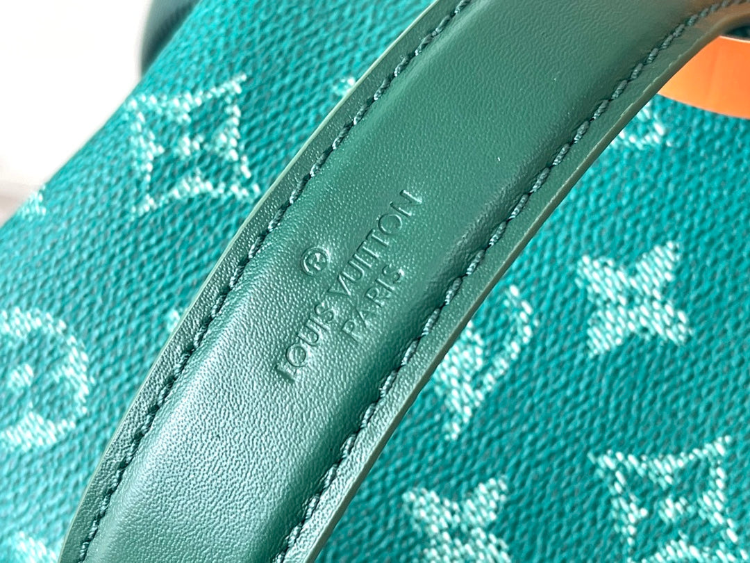 LOUIS VUITTON DISCOVERY BACKPACK 38 IN GREEN MONOGRAM HERITAGE CANVAS