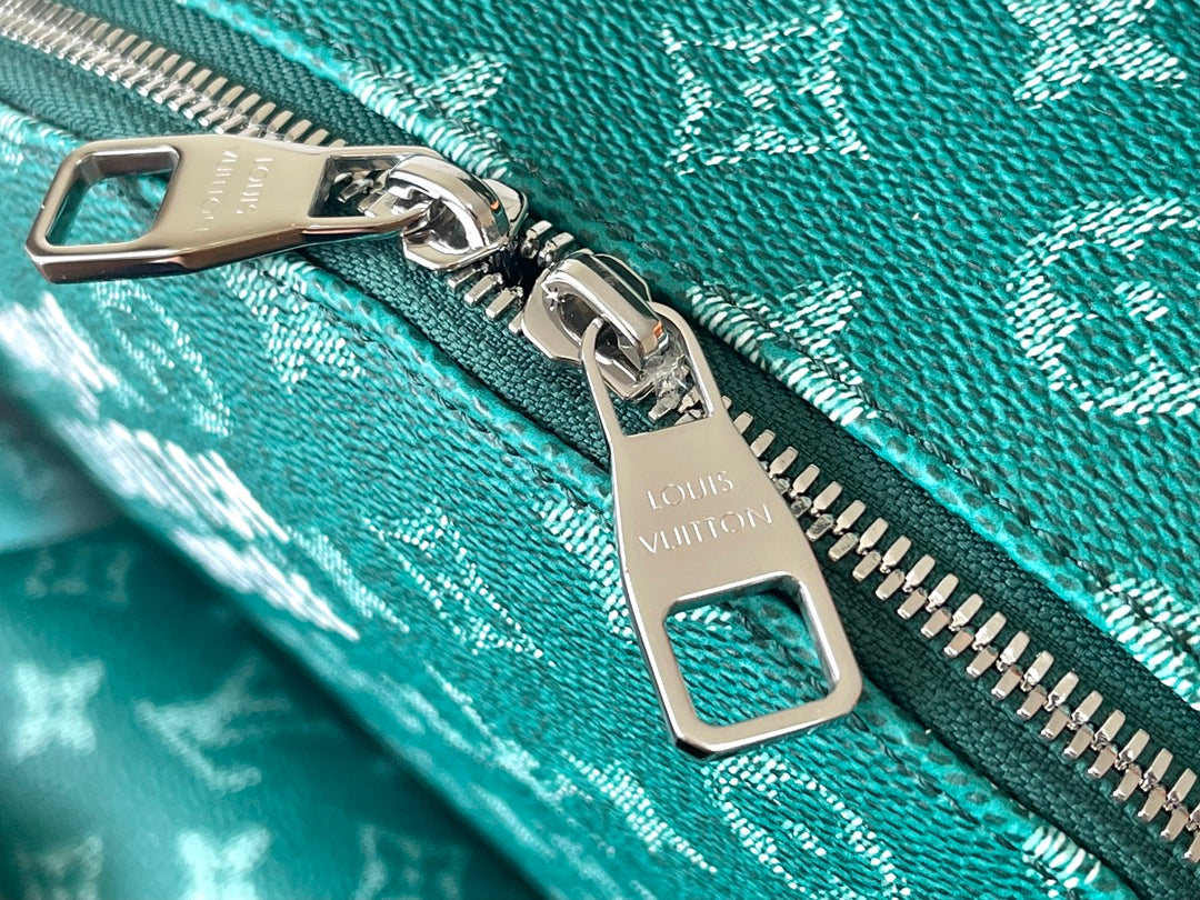LOUIS VUITTON DISCOVERY BACKPACK 38 IN GREEN MONOGRAM HERITAGE CANVAS
