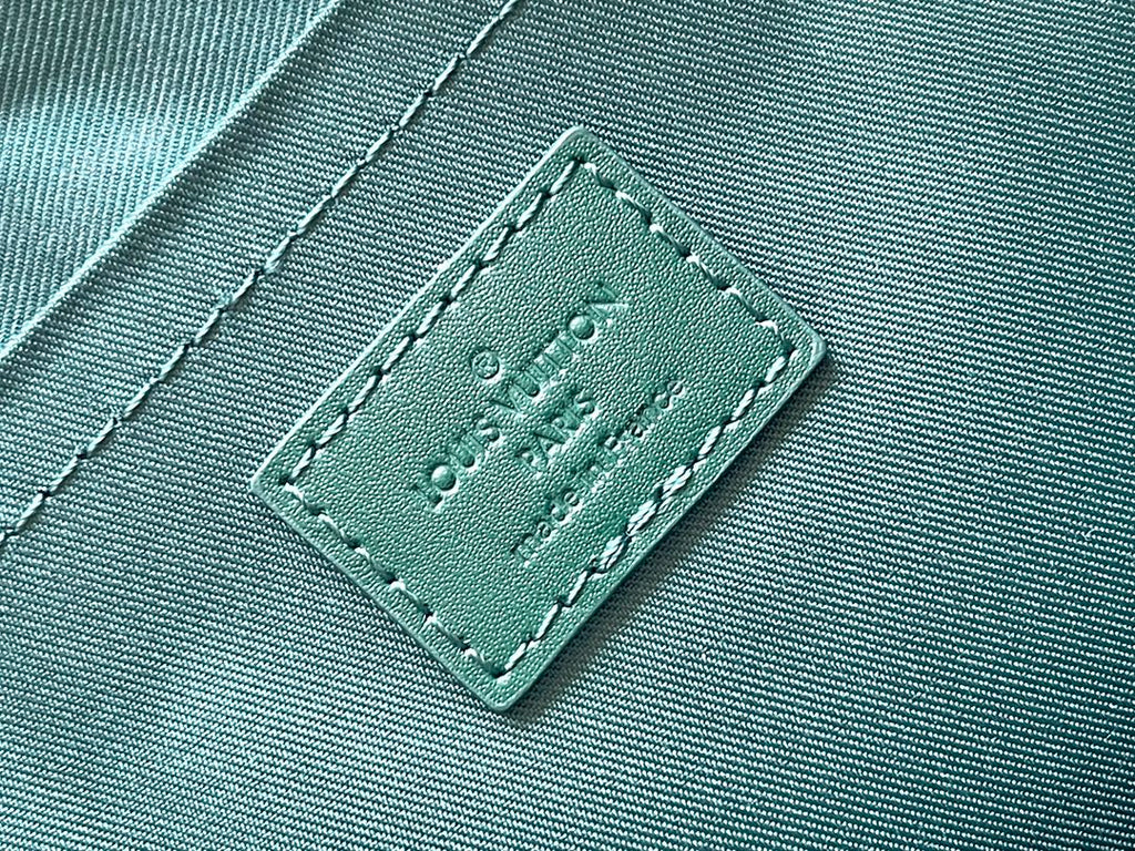 LOUIS VUITTON POCHETTE VOYAGE SOUPLE 32 IN GREEN MONOGRAM HERITAGE CANVAS