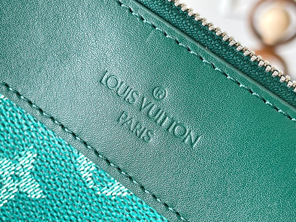 LOUIS VUITTON POCHETTE VOYAGE SOUPLE 32 IN GREEN MONOGRAM HERITAGE CANVAS