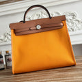 HERMES ZIP CABINE 31 BAG IN APRICOT ORANGE CANVAS AND BRONZE BROWN CALFSKIN