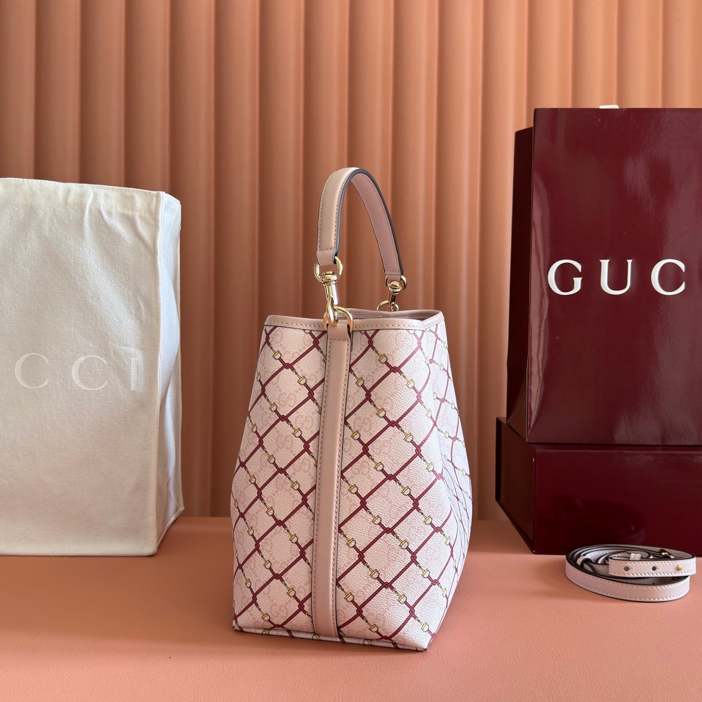 GUCCI 26S  EMBLEM BUCKET BAG 25 IN LIGHT PINK COATED FABRIC