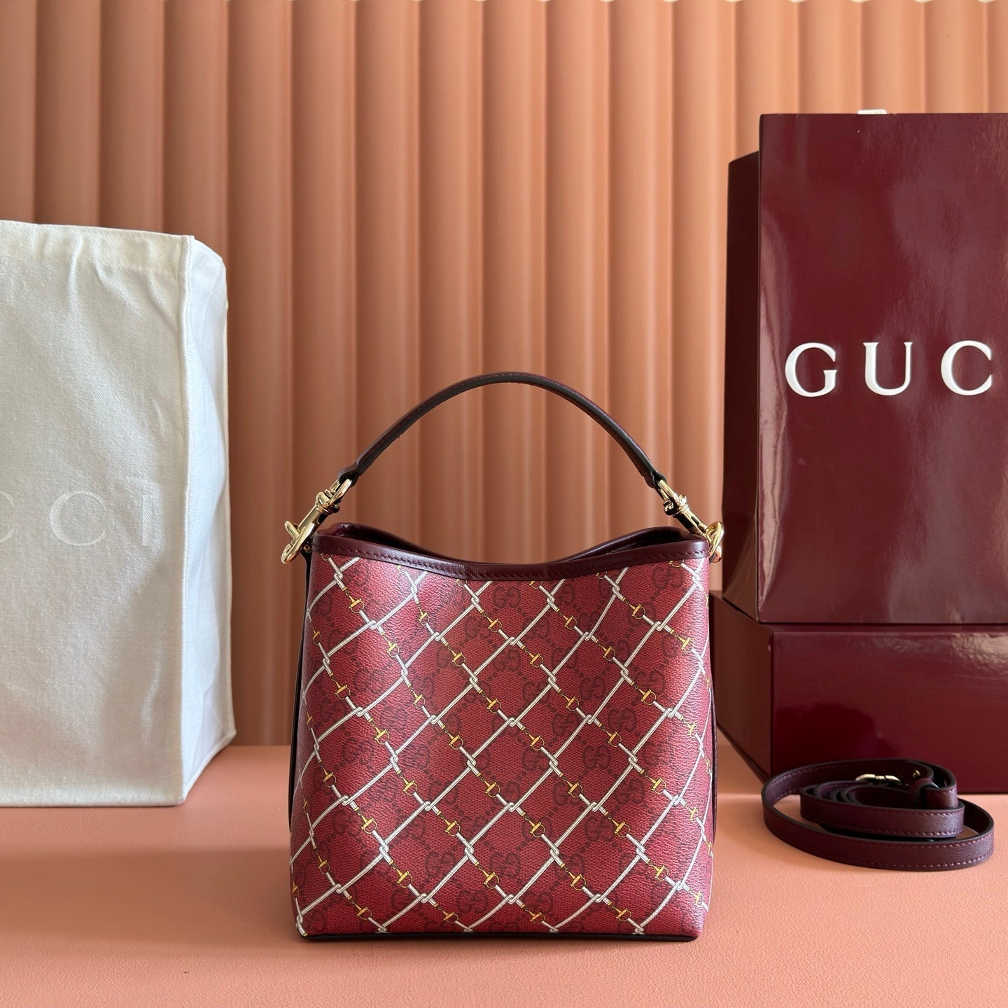 GUCCI 26S  EMBLEM BUCKET BAG 19 IN DARK RED COATED FABRIC