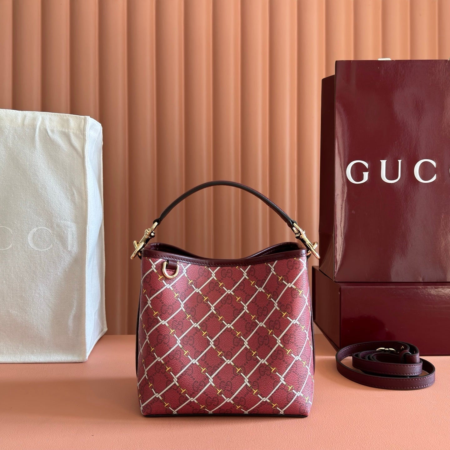 GUCCI 26S  EMBLEM BUCKET BAG 19 IN DARK RED COATED FABRIC