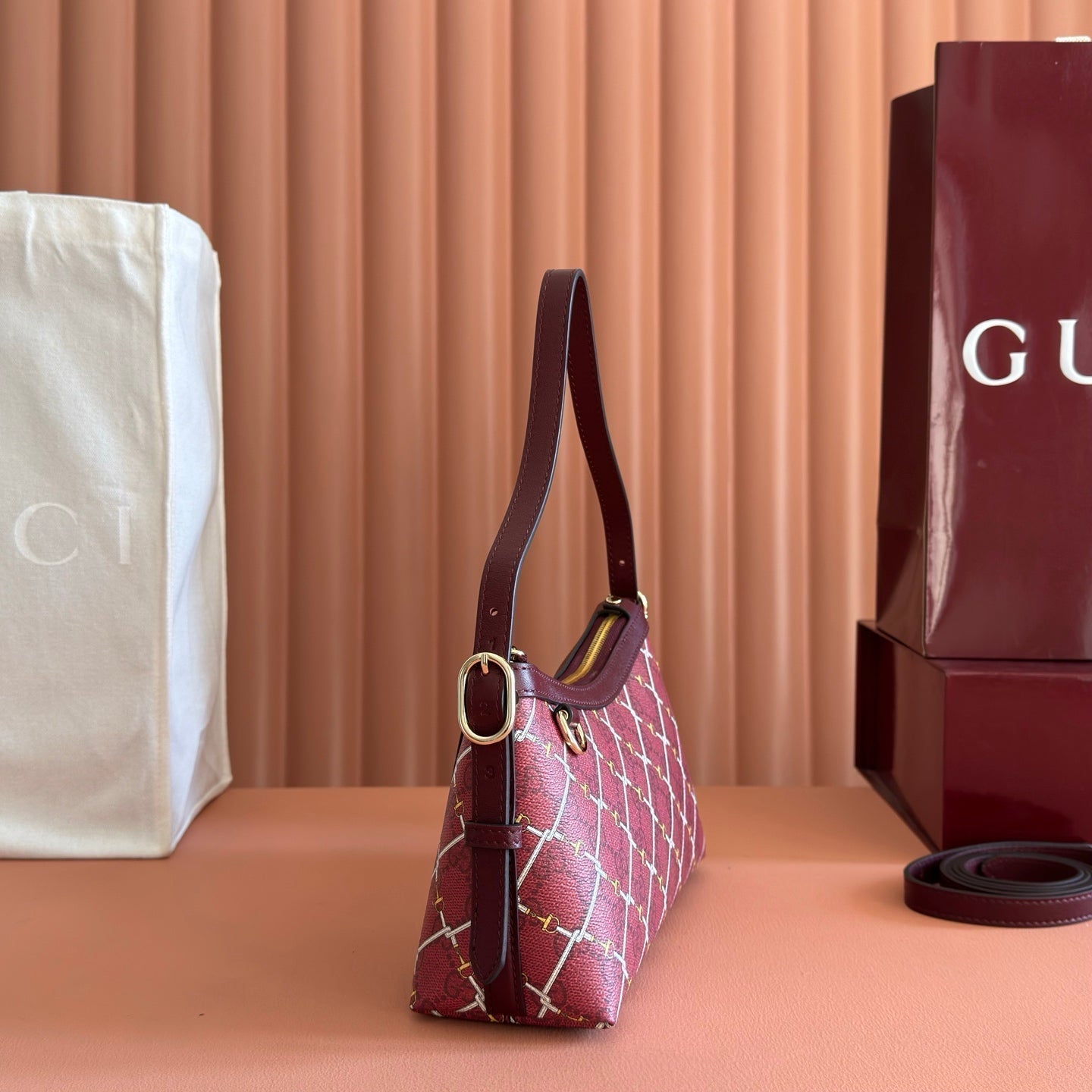 GUCCI 26S  EMBLEM BUCKET BAG 22 IN DARK RED COATED FABRIC