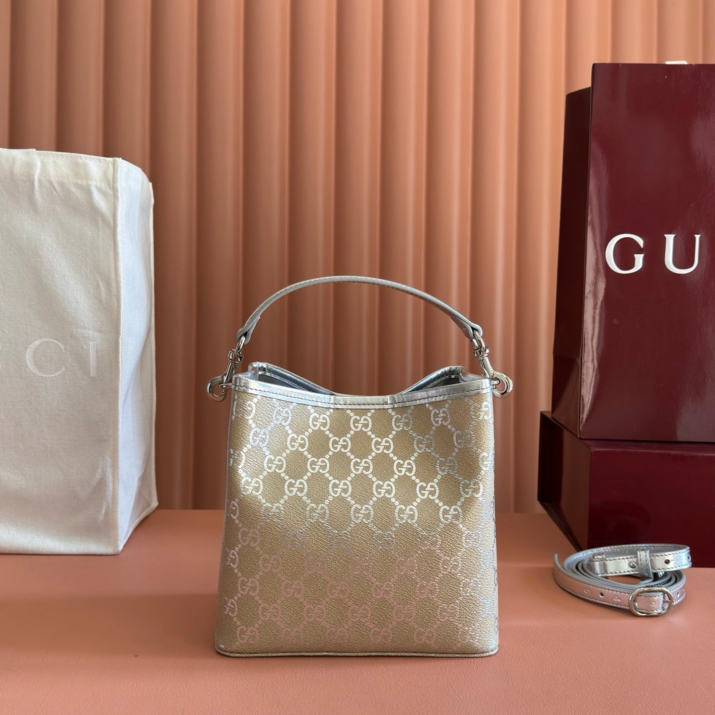 GUCCI 26S  EMBLEM BUCKET BAG 19 IN BEIGE AND SILVER CANVAS