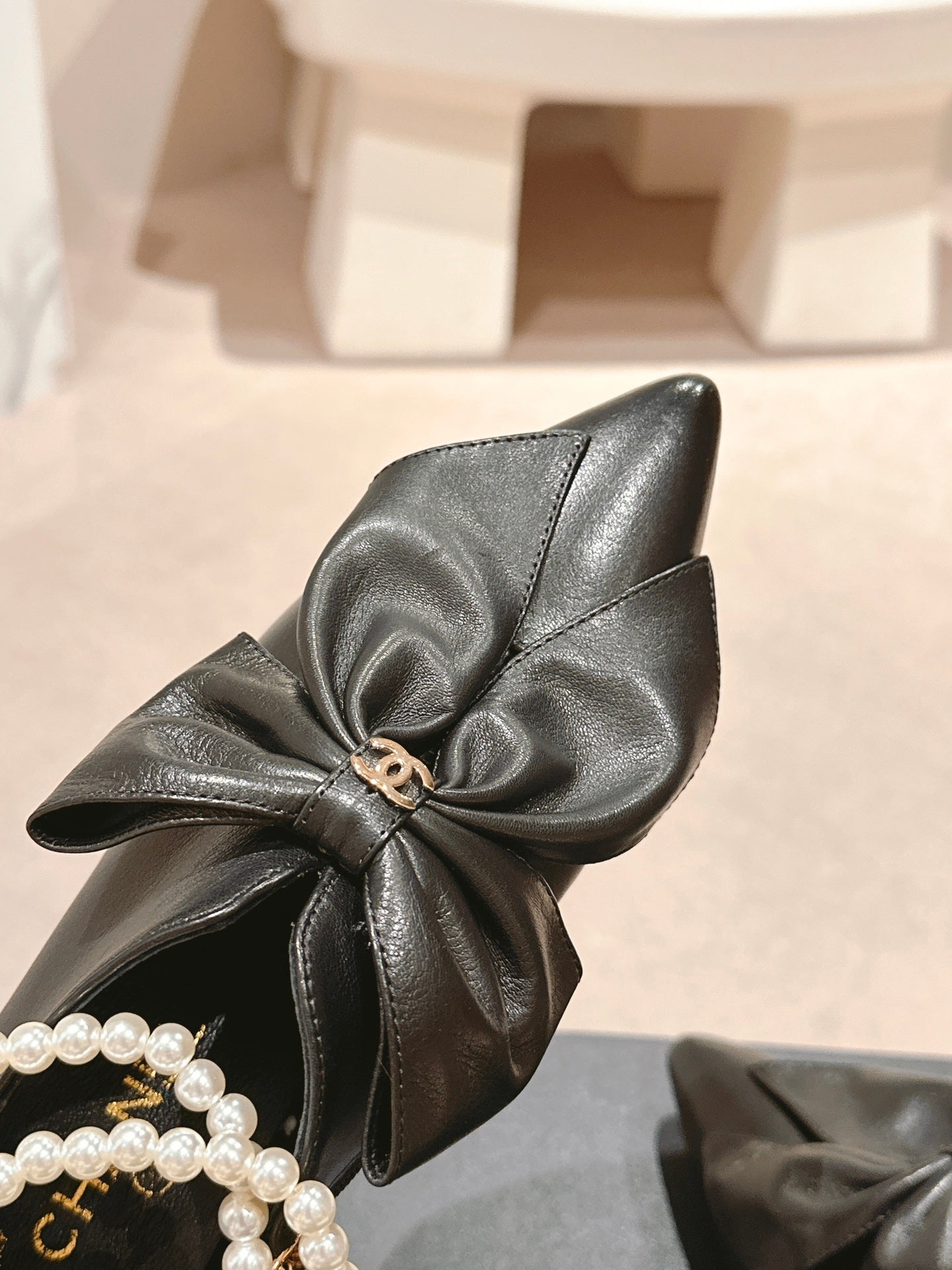 CHANEL SHORT BOOTS IN BLACK SHEEPSKIN WITH BOW