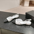 CHANEL SLINGBACKS IN WHITE LAMBSKIN AND BLACK SATIN