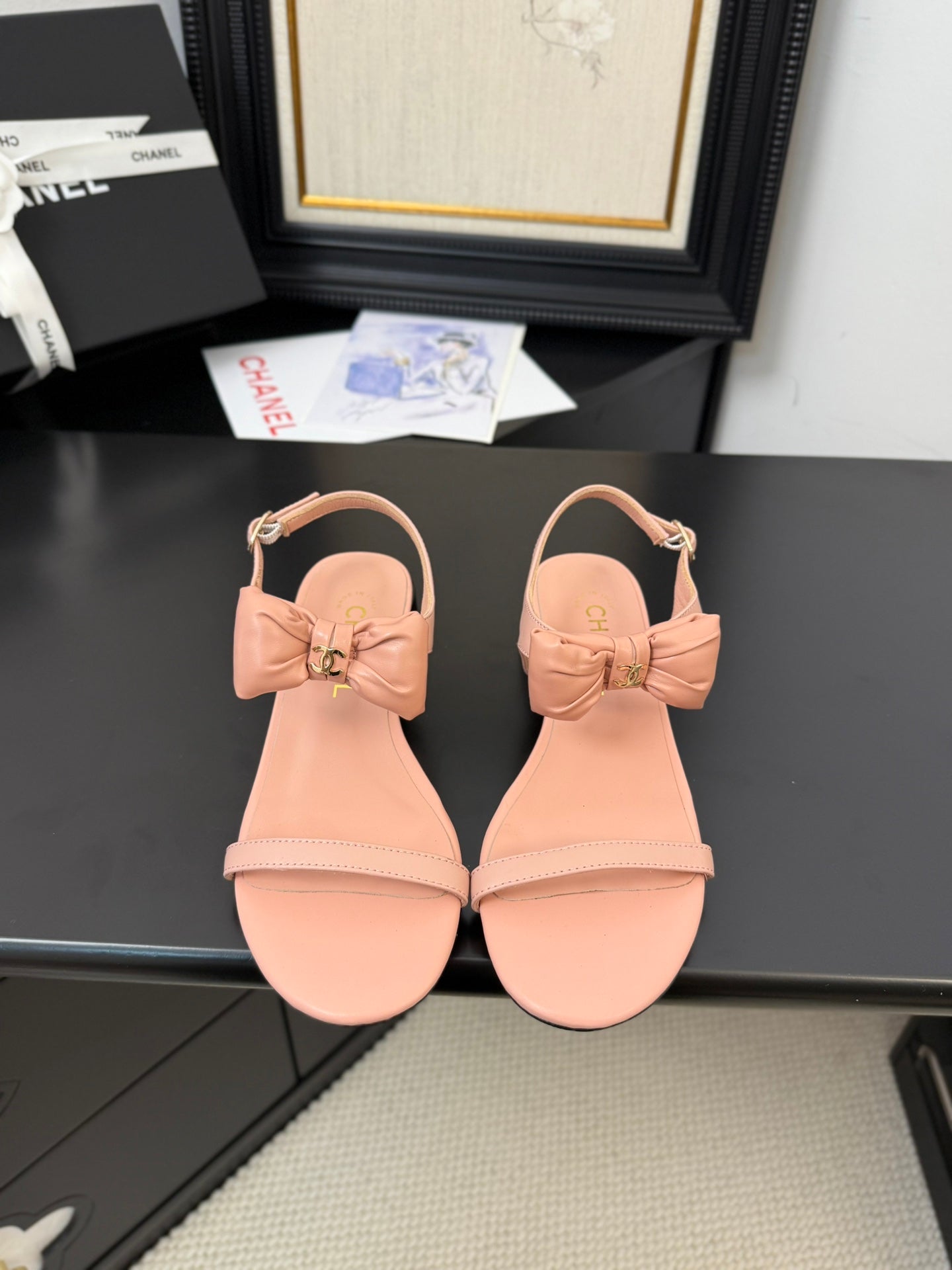 CHANEL FLAT SANDALS IN PEACHY PINK CALFSKIN WITH BOW