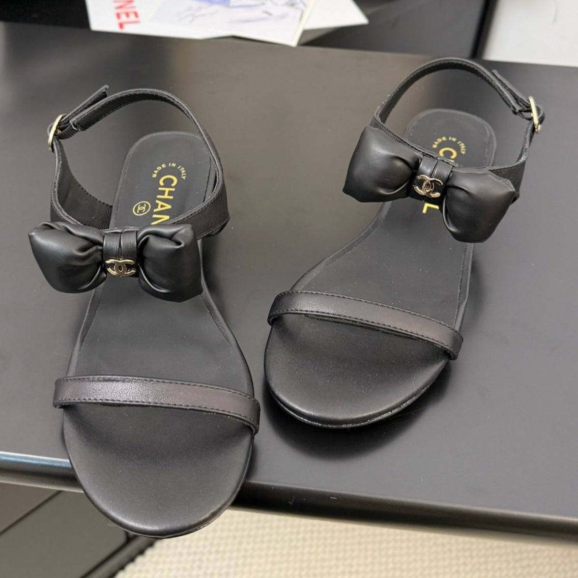 CHANEL FLAT SANDALS IN BLACK CALFSKIN WITH BOW