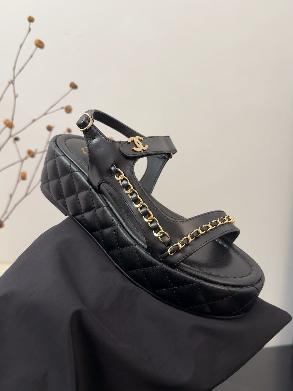 CHANEL THICK-SOLED SANDALS 55 MM IN BLACK CALFSKIN
