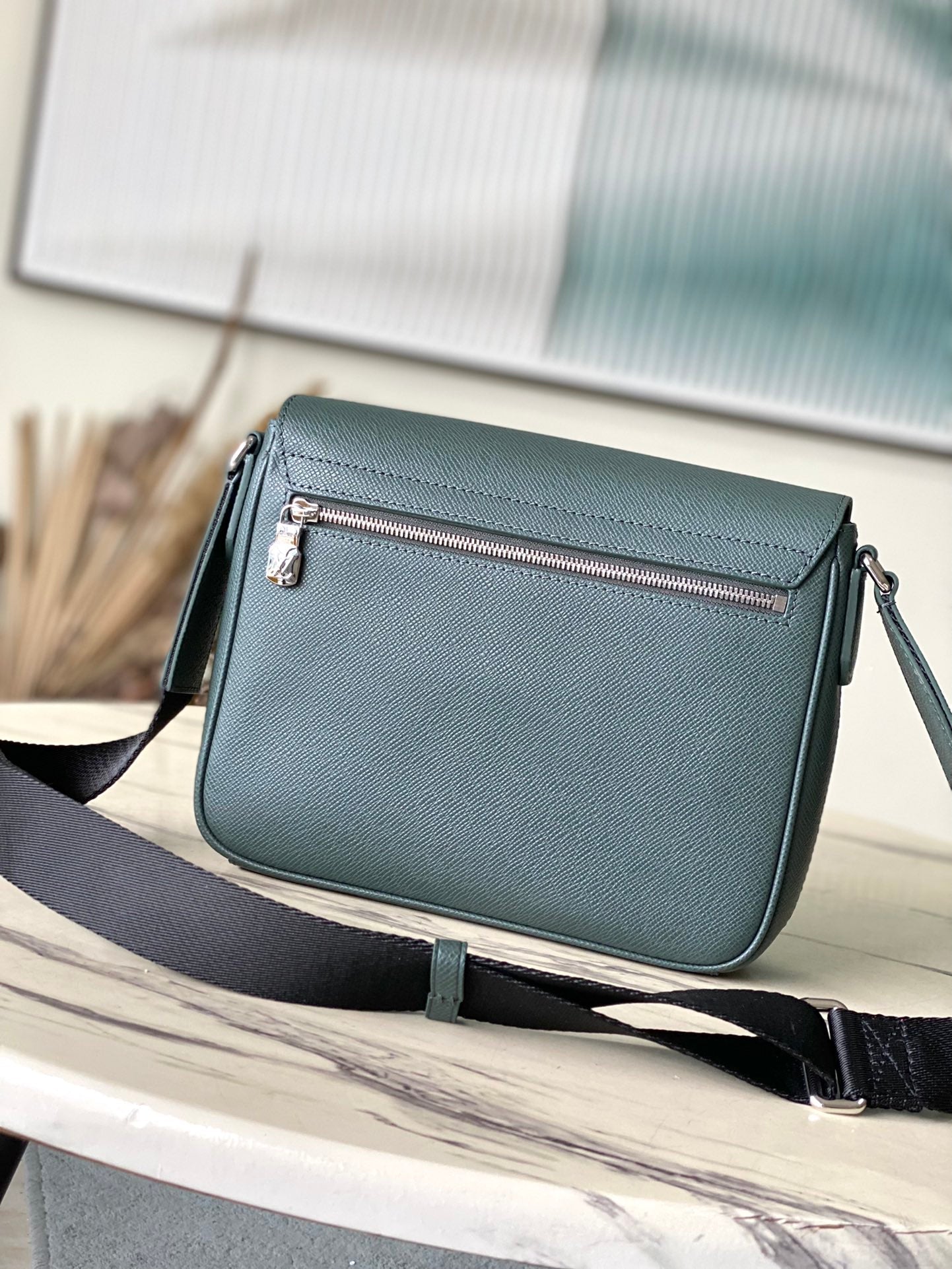 LOUIS VUITTON DISTRICT PM 26 IN CELESTE GREEN CALFSKIN
