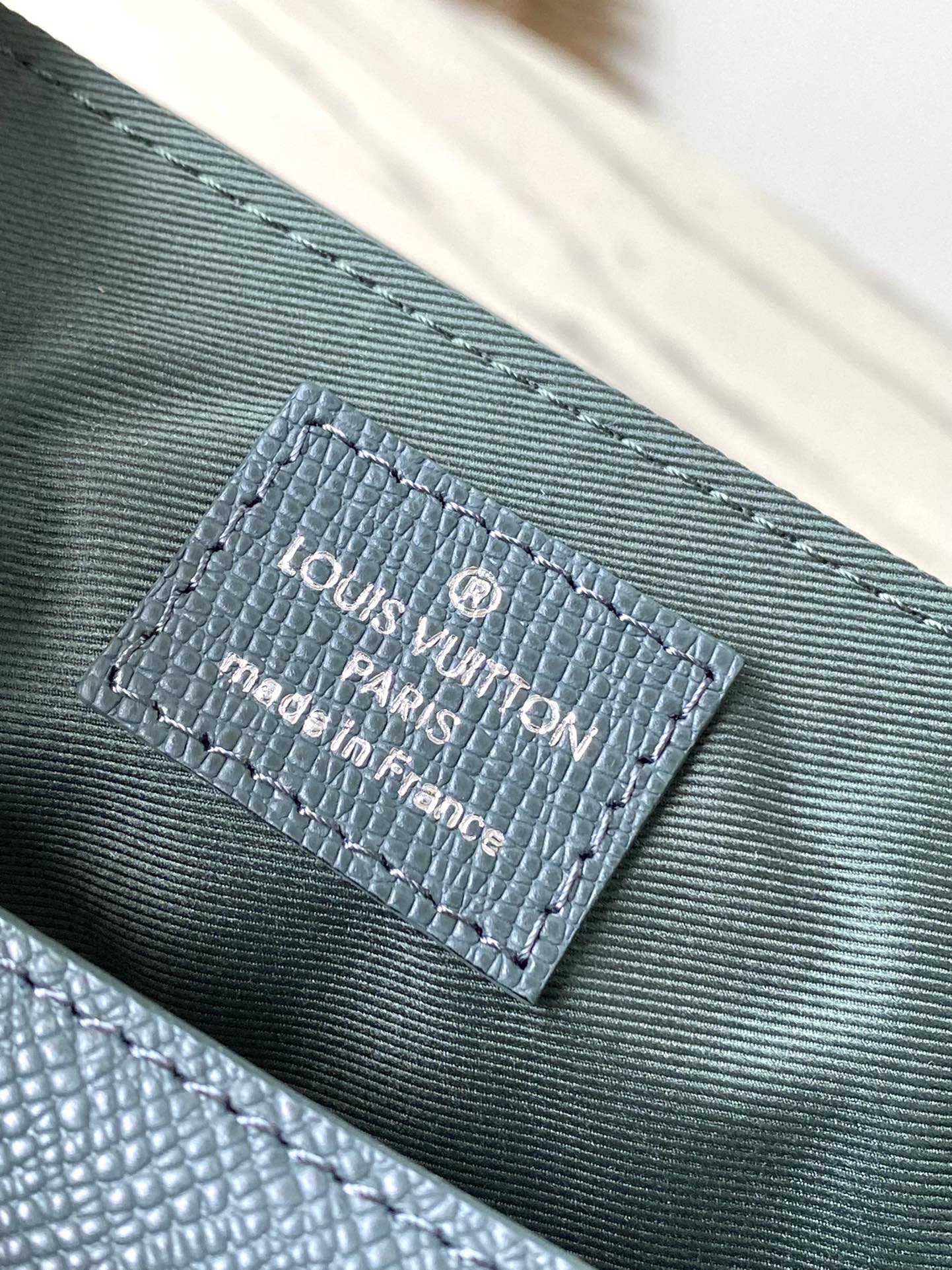 LOUIS VUITTON DISTRICT PM 26 IN CELESTE GREEN CALFSKIN