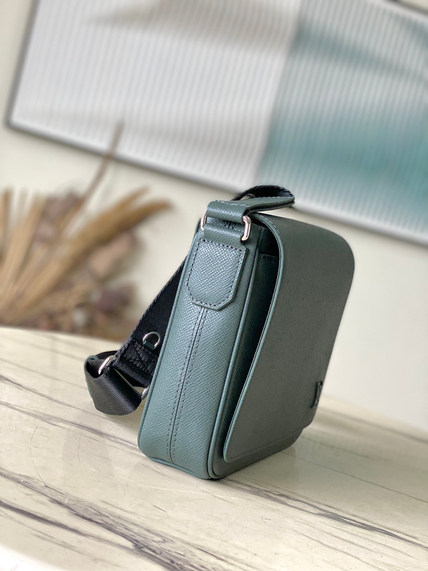 LOUIS VUITTON DISTRICT PM 26 IN CELESTE GREEN CALFSKIN