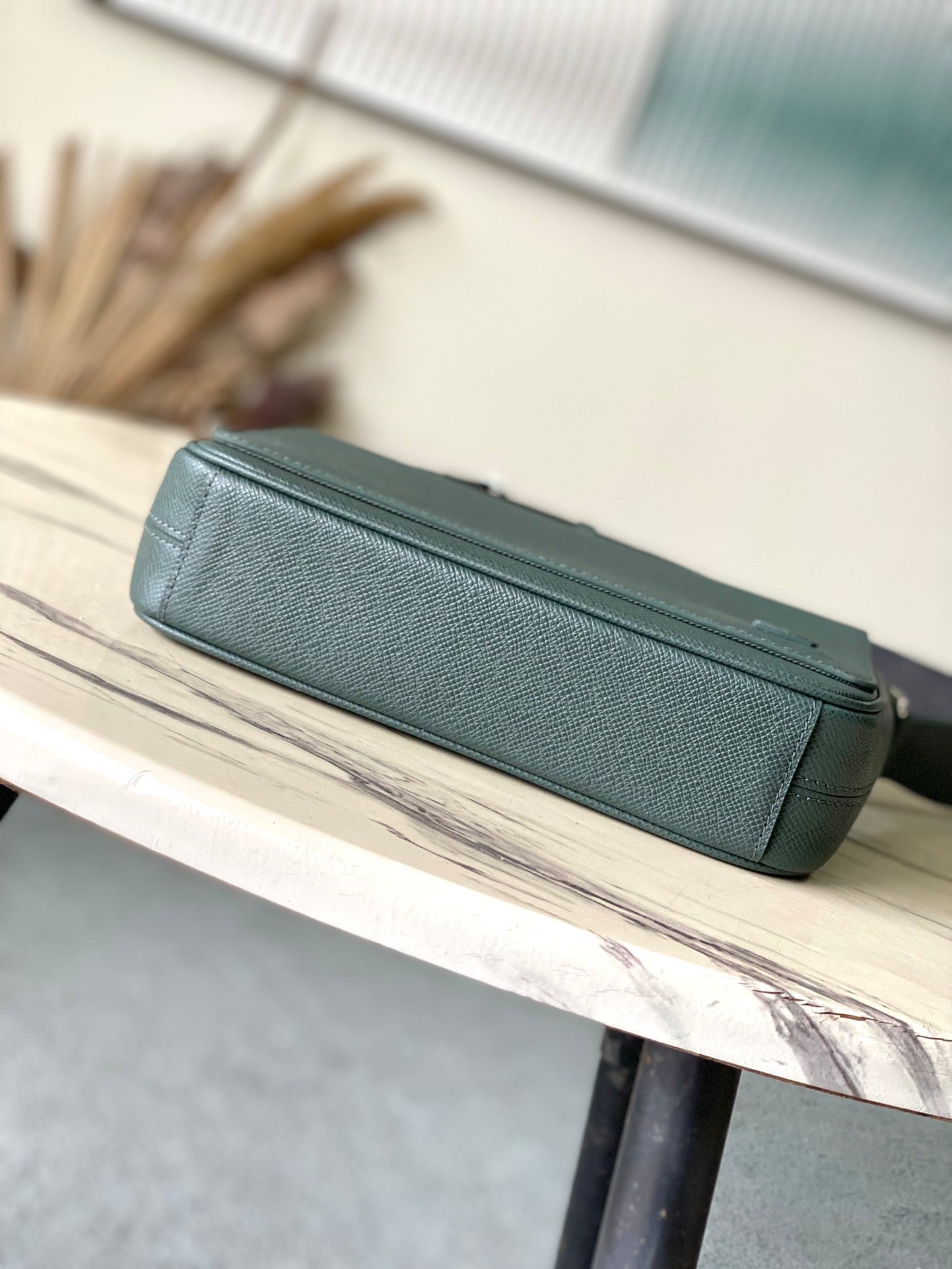 LOUIS VUITTON DISTRICT PM 26 IN CELESTE GREEN CALFSKIN