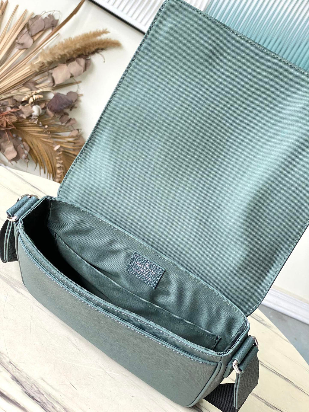 LOUIS VUITTON DISTRICT PM 26 IN CELESTE GREEN CALFSKIN