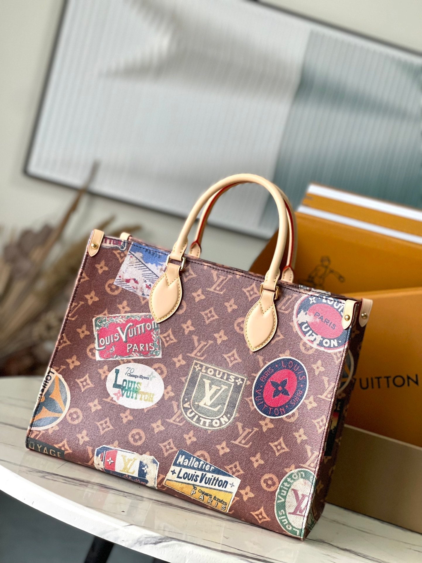 LOUIS VUITTON ONTHEGO VOYAGE 35 IN BROWN MONOGRAM CANVAS WITH VINTAGE HOTEL LABELS