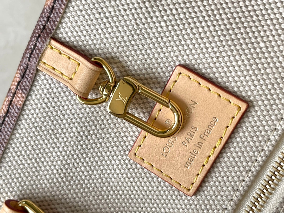 LOUIS VUITTON ONTHEGO VOYAGE 35 IN BROWN MONOGRAM CANVAS WITH VINTAGE HOTEL LABELS