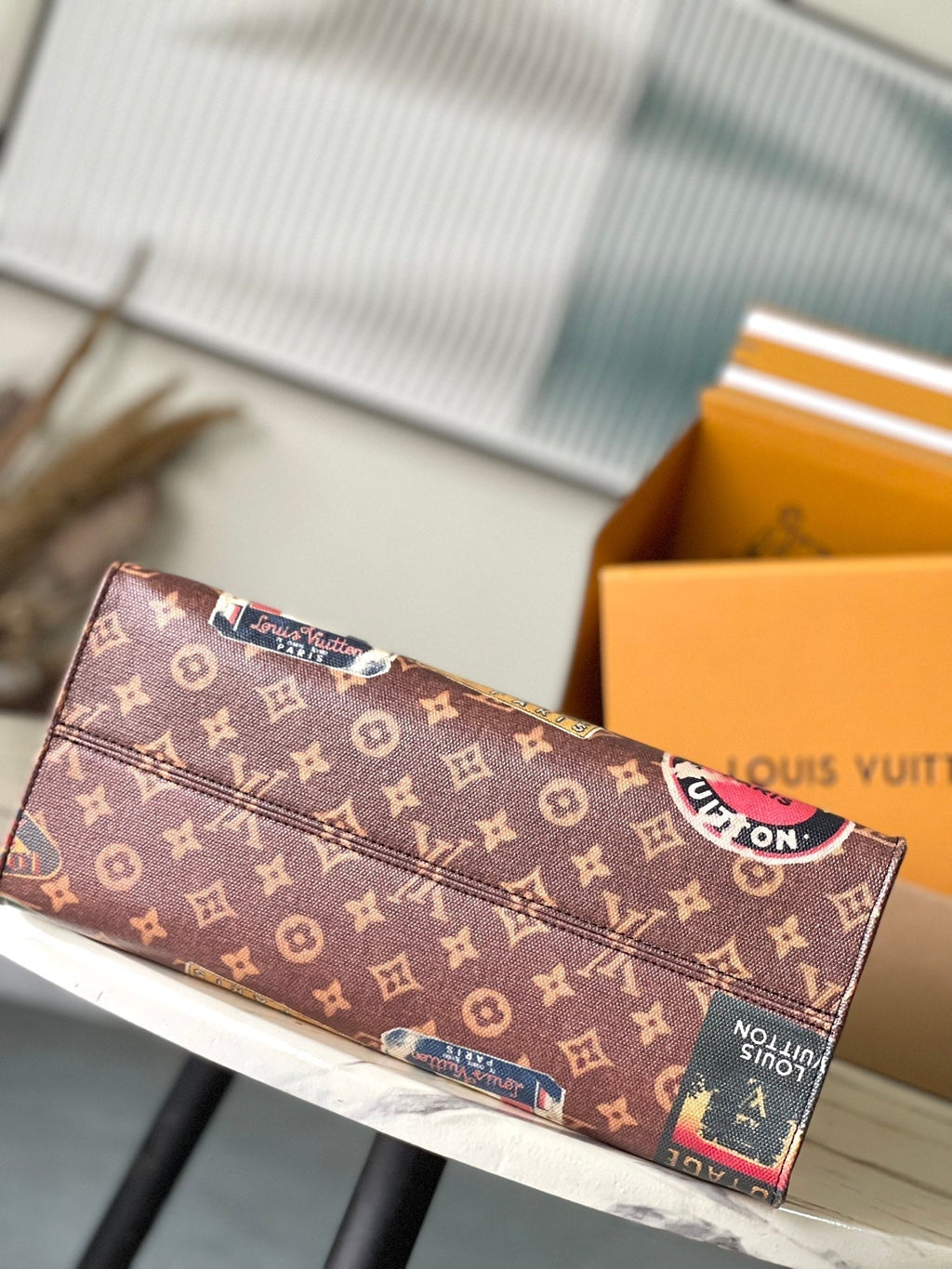 LOUIS VUITTON ONTHEGO VOYAGE 35 IN BROWN MONOGRAM CANVAS WITH VINTAGE HOTEL LABELS