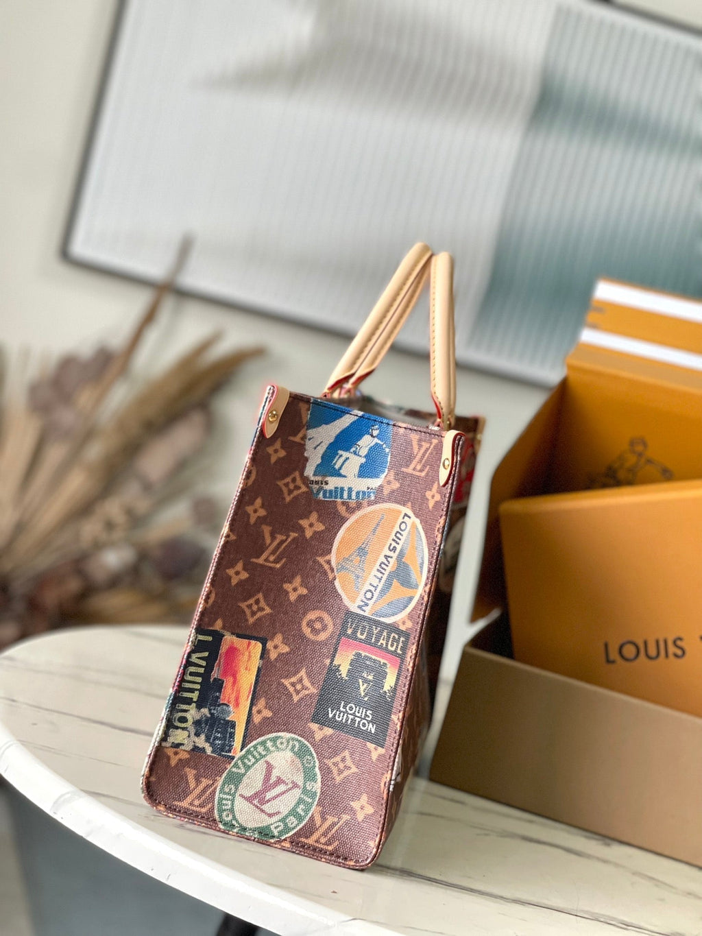 LOUIS VUITTON ONTHEGO VOYAGE 35 IN BROWN MONOGRAM CANVAS WITH VINTAGE HOTEL LABELS