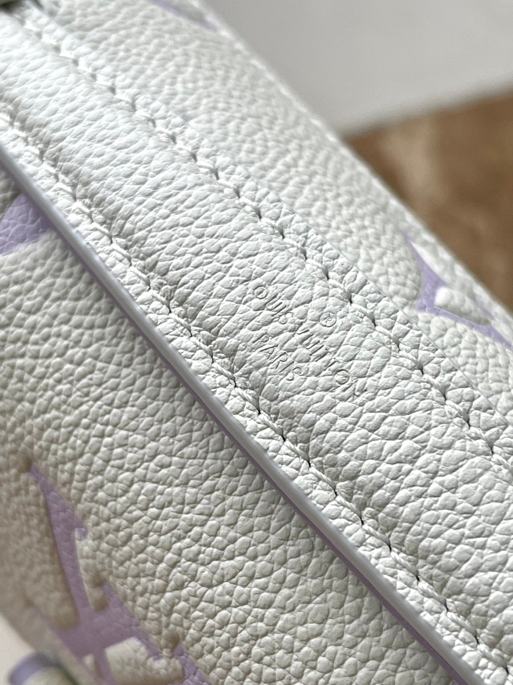 LOUIS VUITTON POCHETTE METIS EAST WEST 21 IN WHITE PURPLE MONOGRAM EMPREINTE LEATHER
