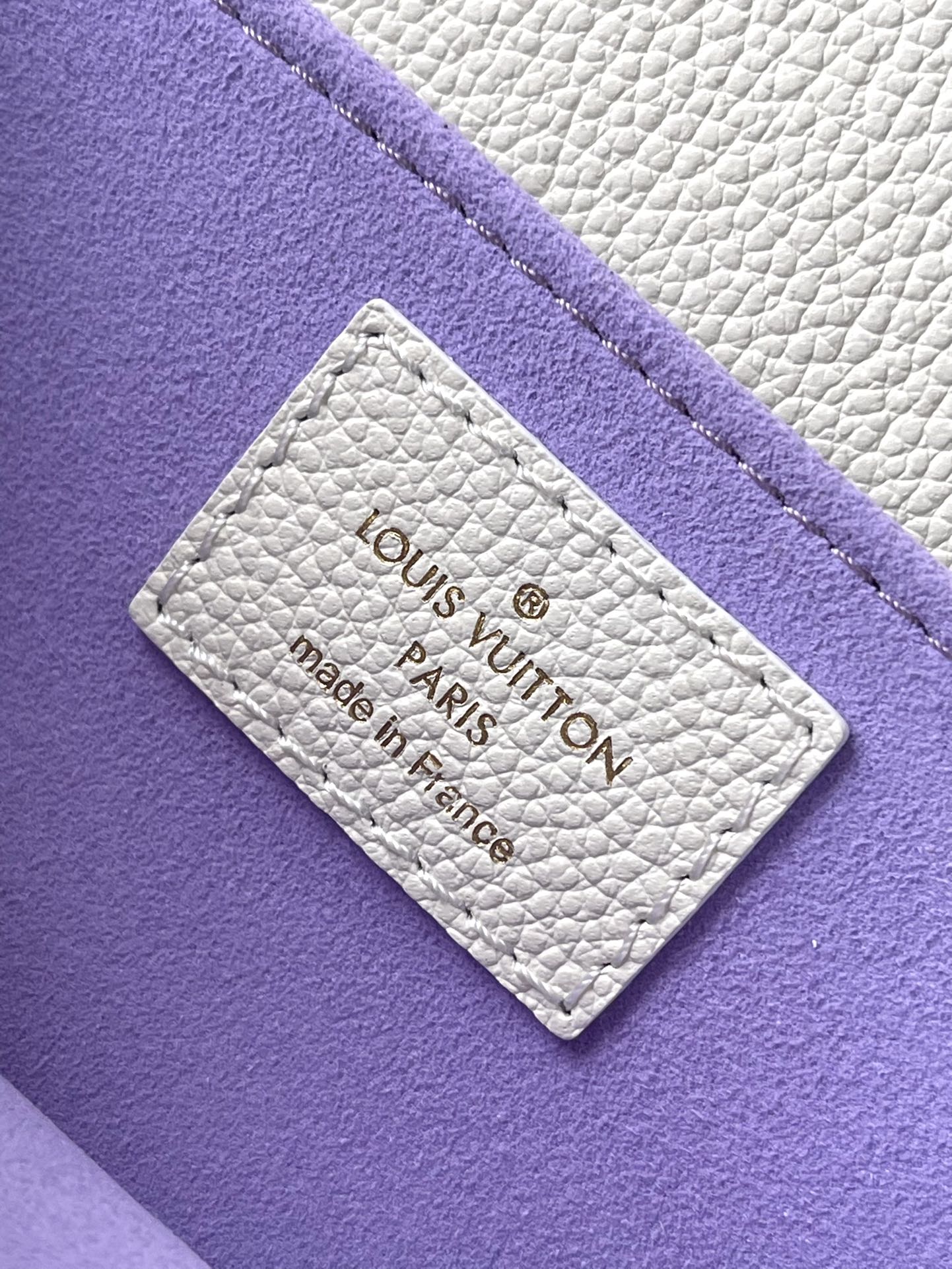 LOUIS VUITTON POCHETTE METIS EAST WEST 21 IN WHITE PURPLE MONOGRAM EMPREINTE LEATHER