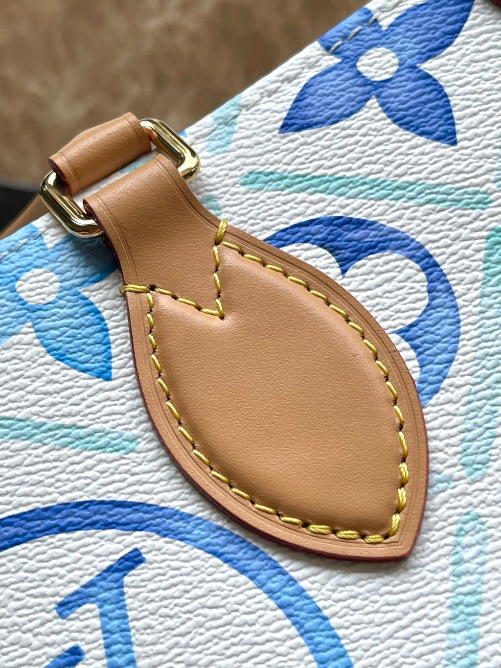 LOUIS VUITTON ONTHEGO EAST WEST 25 IN LAGOON BLUE MONOGRAM TILES CANVAS