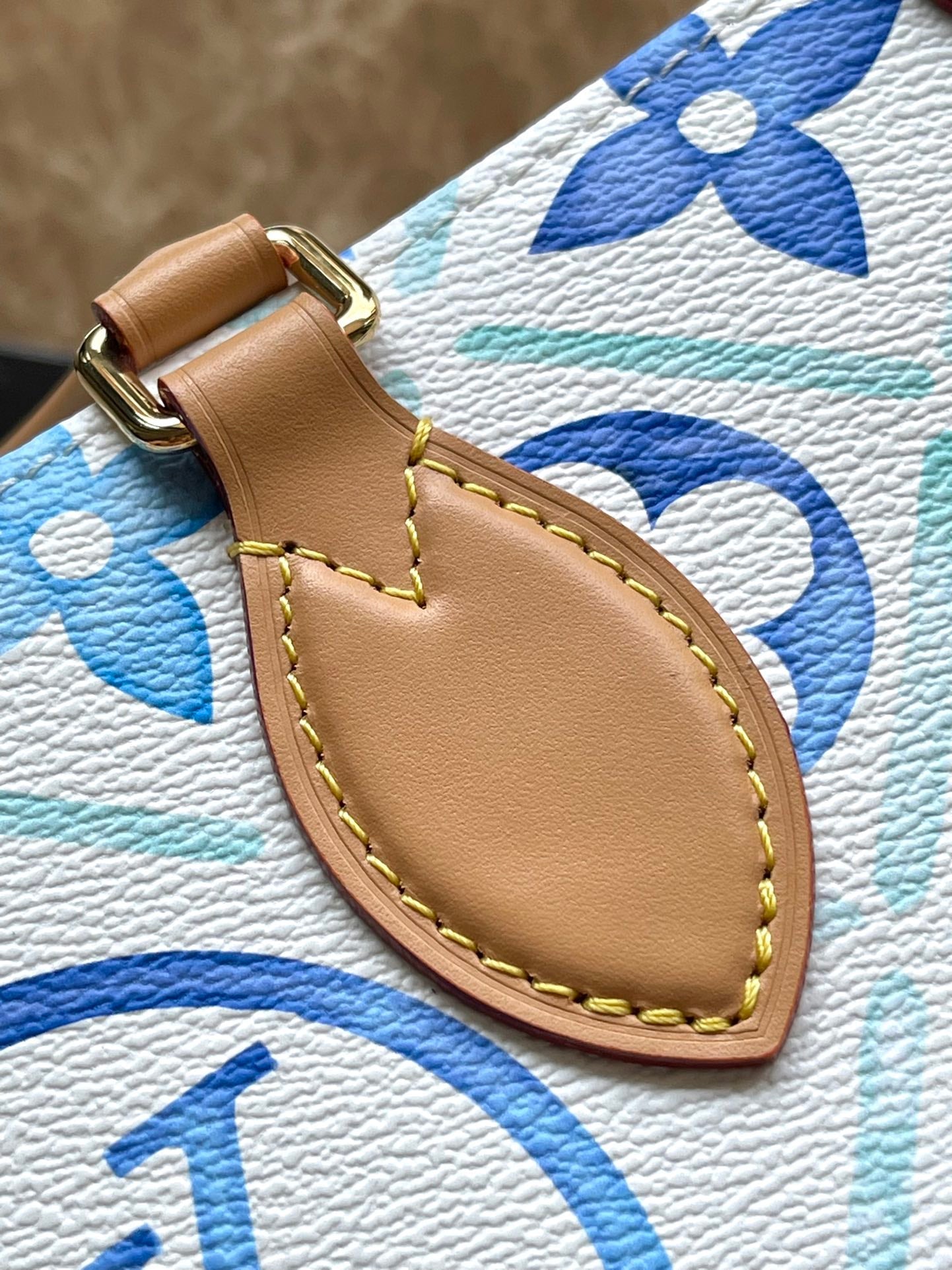 LOUIS VUITTON ONTHEGO EAST WEST 25 IN LAGOON BLUE MONOGRAM TILES CANVAS