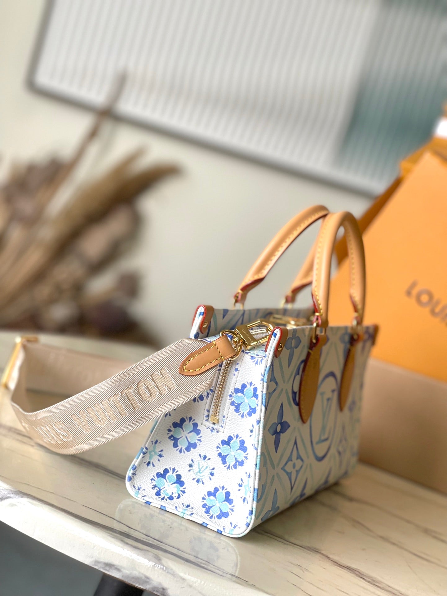 LOUIS VUITTON ONTHEGO EAST WEST 25 IN LAGOON BLUE MONOGRAM TILES CANVAS