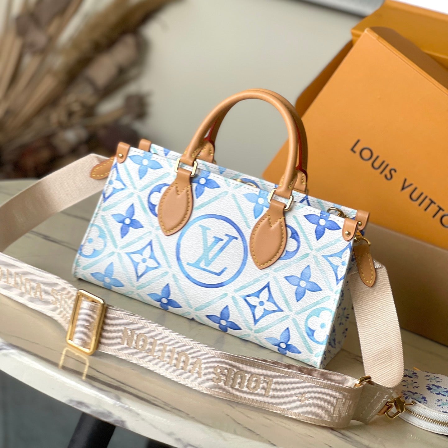 LOUIS VUITTON ONTHEGO EAST WEST 25 IN LAGOON BLUE MONOGRAM TILES CANVAS