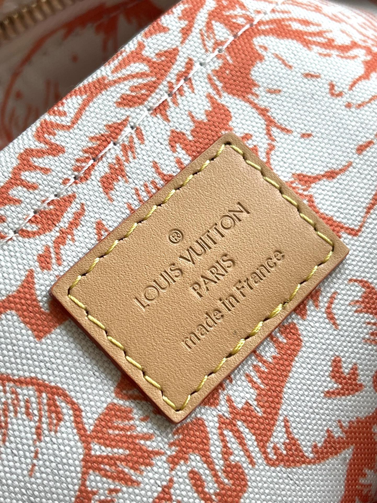 LOUIS VUITTON ONTHEGO EAST WEST 25 IN CORAL MONOGRAM TILES CANVAS