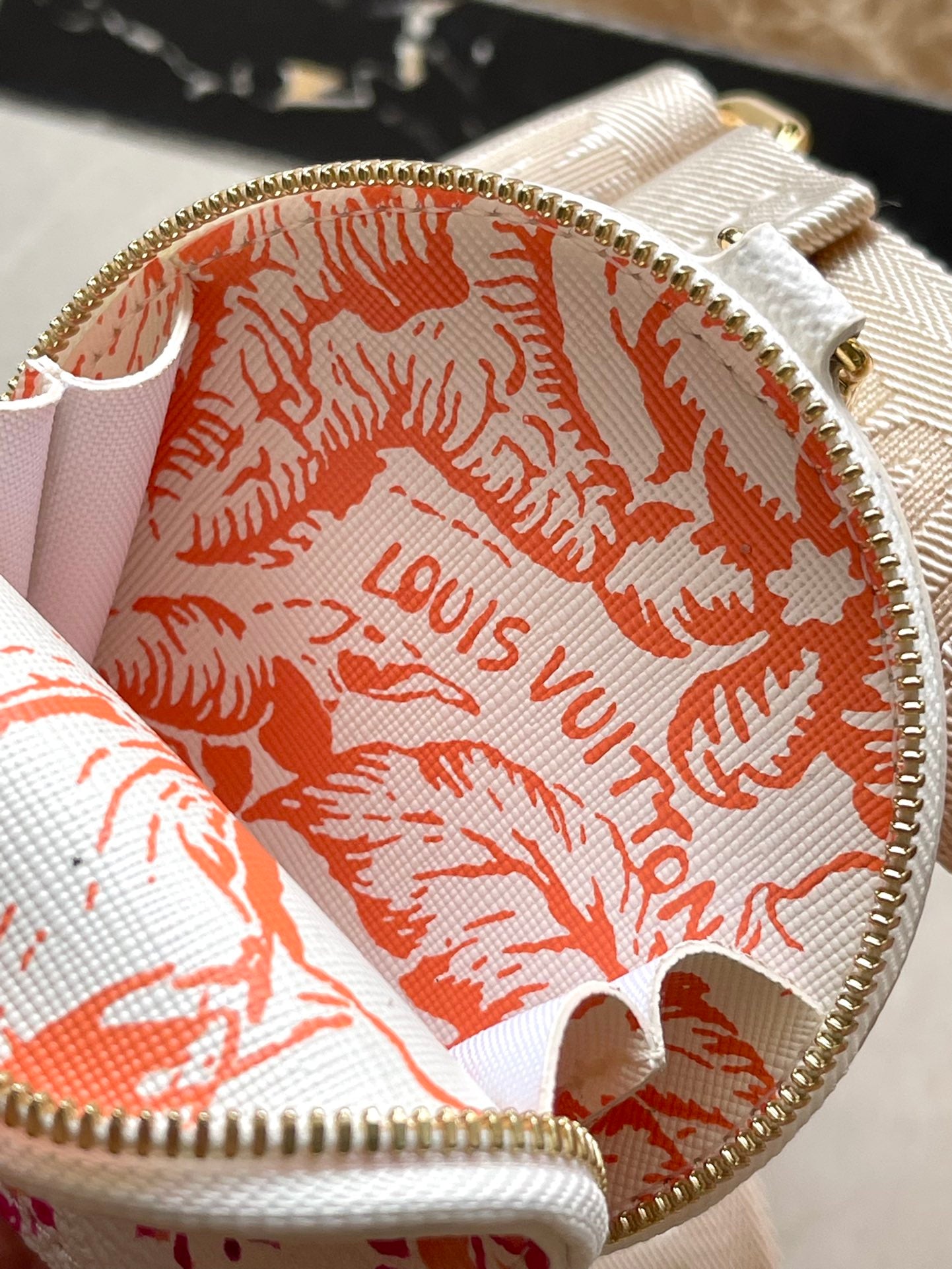 LOUIS VUITTON ONTHEGO EAST WEST 25 IN CORAL MONOGRAM TILES CANVAS